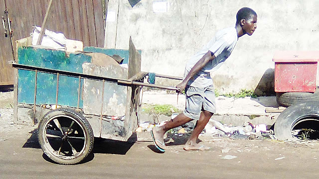 Image result for cart and wheelbarrow pushers in lagos