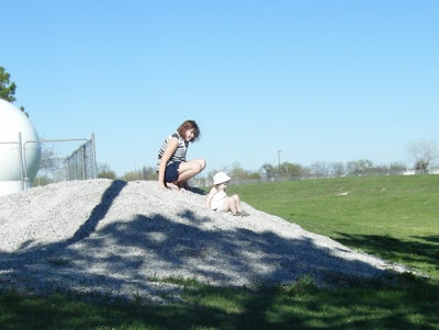 My girls sliding down a gravel hill