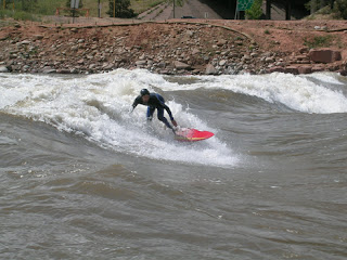 A surfer at the Glenwood Springs Whitewater Park