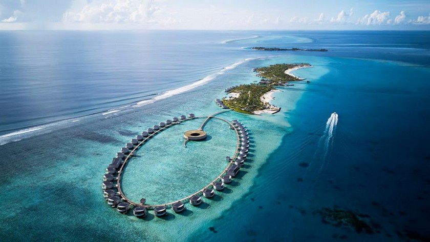 water based trips an aerial view of a floating resort in the middle of the ocean, a beautiful sea landscapes with islands and modern floating villas