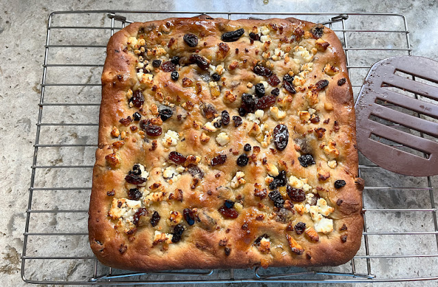 Food Lust People Love: Slightly sweet and a little savory, this feta and mixed fruit focaccia is the perfect snack to eat with a cup of tea or even a cold glass of beer or a cocktail. The somewhat bitter candied peel and soaked dried fruit are a great combination with the salty feta and soft pillowy bread.