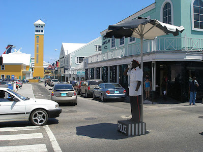 Police officer directing traffic on Bay St., Nassau, Bahamas.