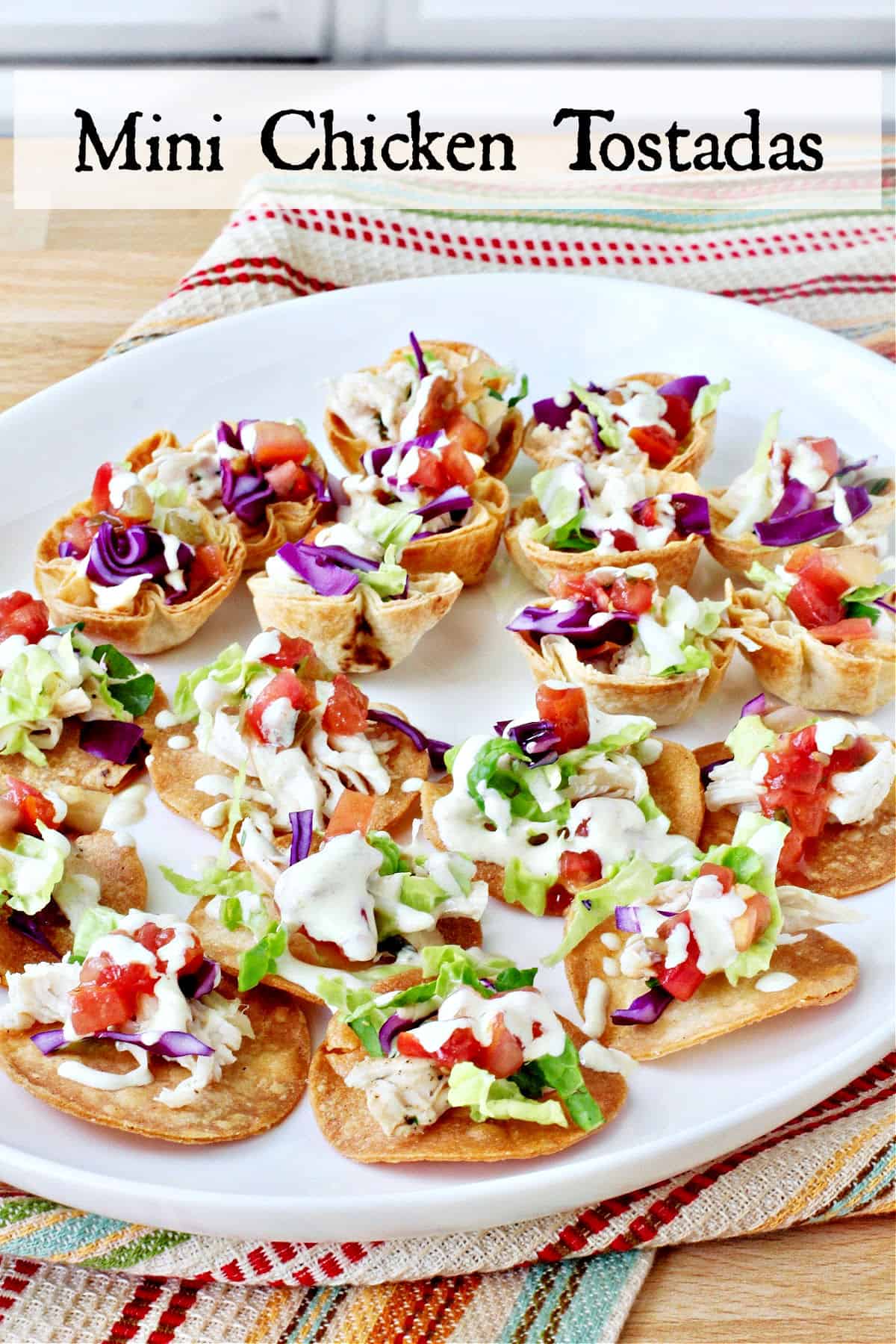 Mini Chicken Tostada Appetizers on a white platter.