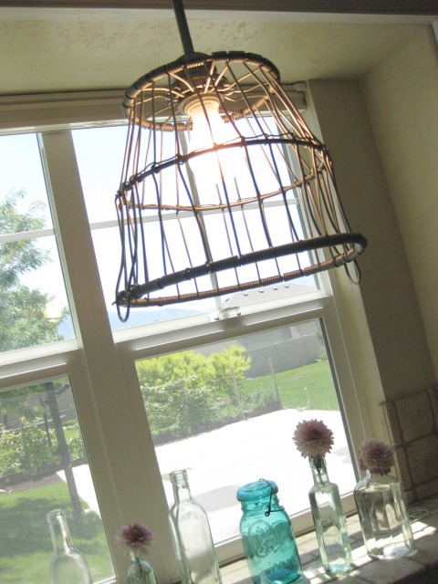 metal basket turned light fixture, and a window makeover