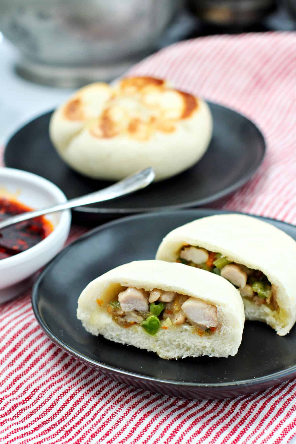 Steamed Chicken and Vegetable Buns on plates.