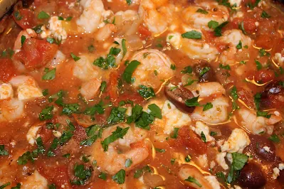 Skillet of baked shrimp and feta.