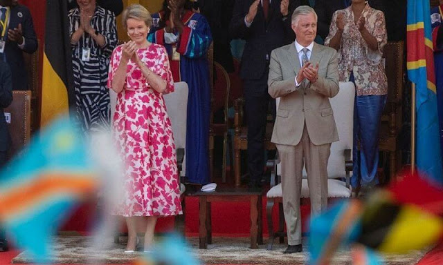 Queen Mathilde wore a cape red flower silk midi dress moody florals by Dries Van Noten