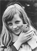 Diana Spencer as a young girl, holding a pet guinea pig. (diana spencer princess of wales childhood)