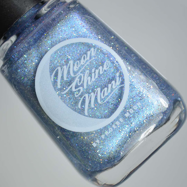 holographic blue nail polish in a bottle