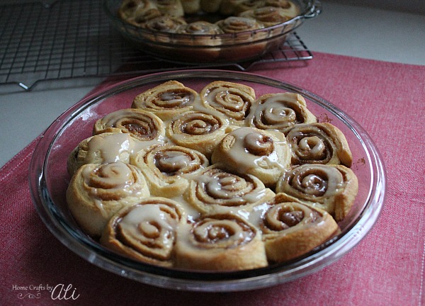 iced cinnamon rolls in pan and ready to eat