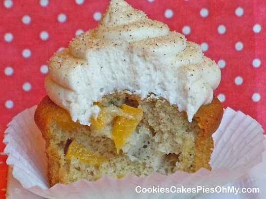 http://cookiescakespiesohmy.wordpress.com/2012/05/29/peach-cobbler-cupcakes-with-cinnamon-honey-buttercream-frosting/