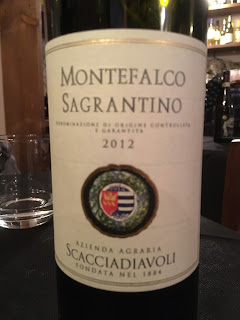 A bottle of Umbria's Scacciadiavoli Sagrantino wine