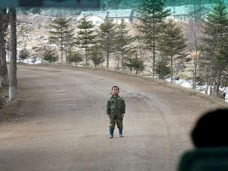 a north korean boy head off the bus