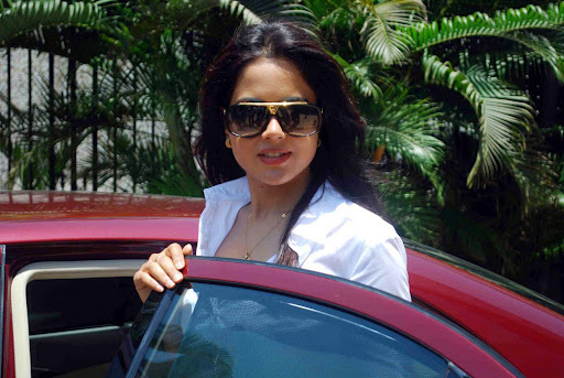 Actress Sameera Reddy hot and sexy unseen photoshoot in white shirt as the brand ambassador of Dreams Home NGO