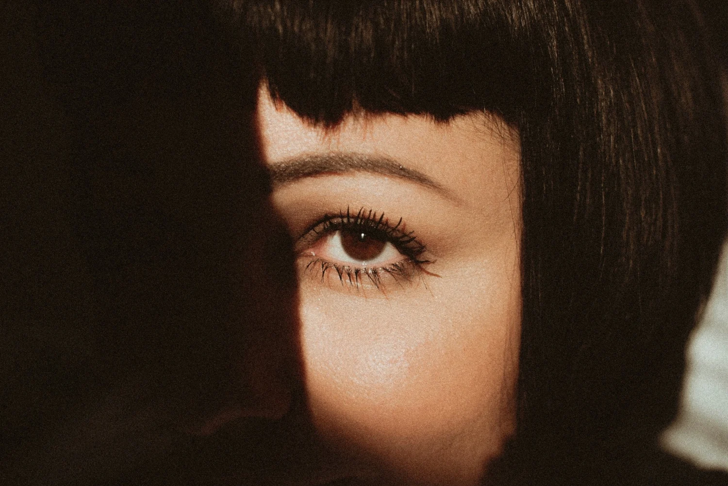 close-up of woman's face with long, beautiful eyelashes