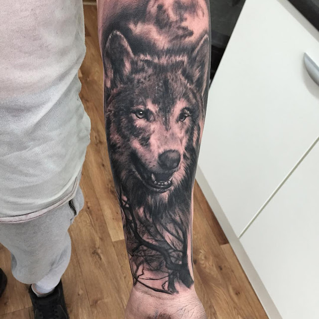 Idea for a wolf head tattoo into the woods