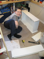 Joshua assembling flat pack furniture