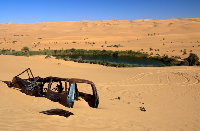 Ubari lakes were located in the southern regions of Wadi Irawan, Wadi al-Ajal and the Ubari Sand Sea. The archaeological finds from the area include dark layers of organic matters, shells, hand axes and other Palaeolithic and Neolithic implements and tools which strongly suggested ancient human activity in Fezzan. These lakes were part of a larger network of lakes which have included the legendary nearby Lake Tritonis and Lake Chad among numerous other smaller lakes