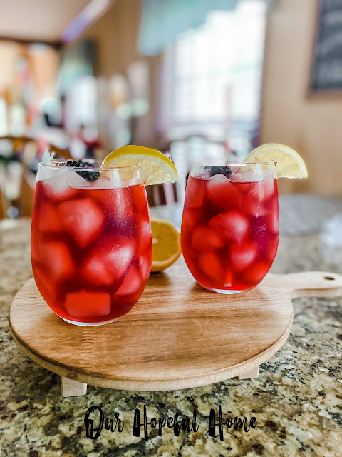 bright red passion tango tea with ice and lemons