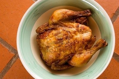 262907-prepared-whole-chicken-on-a-plate-tile-background
