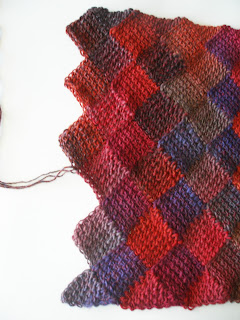 rainbow colored diamonds and triangles in a shawl