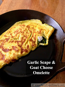 This vegetarian omelette is stuffed with garlic scapes, parsley, and creamy goat cheese for a fresh Spring flavor using what's growing right now.