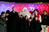 President George W. Bush and Laura Bush join entertainers Eartha Kitt, left, and Cathy Rigby, center, along with Santa Claus, invited children and The Singing Angels choir director Charles Eversole, right, on stage Thursday, Dec. 7, 2006, at the 2006 Christmas Pageant of Peace and the 83rd lighting of the National Christmas Tree on the Ellipse in Washington, D.C. White House photo by Kimberlee Hewitt.