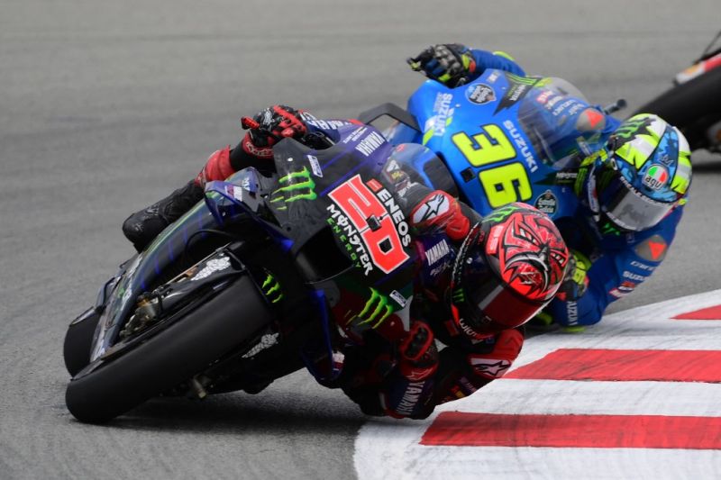 Archive photo - Yamaha's Fabio Quartararo ahead of Suzuki's Joan Mir in the MotoGP Grand Prix de Catalunya race June 6, 2021. (BORNEOTRIBUN/AFP/LLUIS GENE)