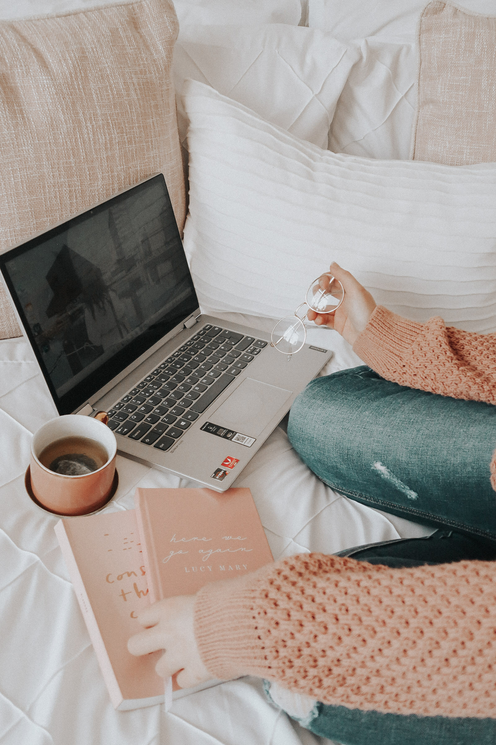 A laptop and a cup of green tea.