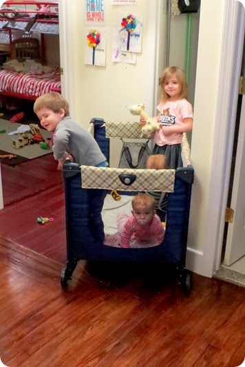 Four kids in a pack n play