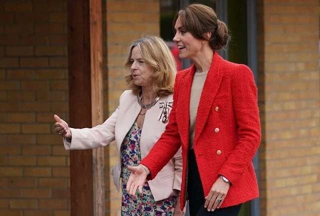 Princess of Wales wore a red textured double-breasted blazer by Zara. Spells of Love twist gold hoops
