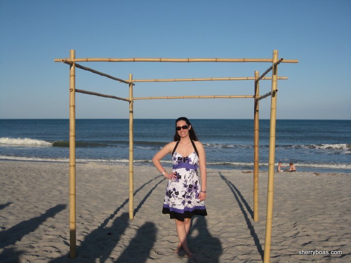 A beachside wedding arbor made from bamboo