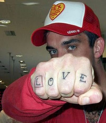 Enjoy some pictures of Robbie Williams and his tattoos.