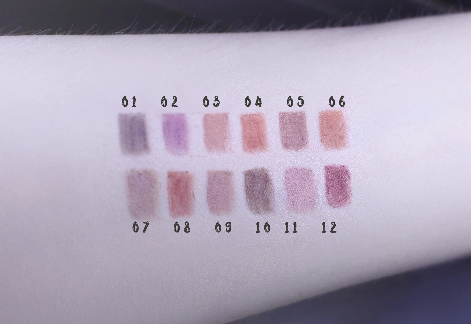 12 swatches of the nude lip pencil set on a light skin