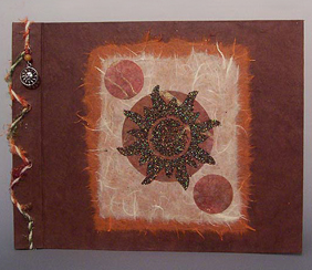 handmade photo album with sun image on the cover