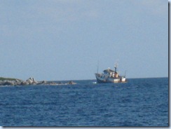 Boat on rocks at Round Island