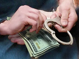 handcuffs and money