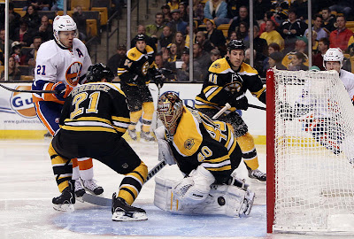 Tuukka Rask makes a save against the Islanders