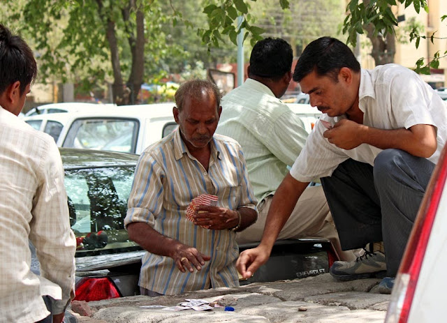 men gambling on the street