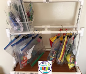 DIY Hanging Bag Shelf for storing station materials and Busy Bags.