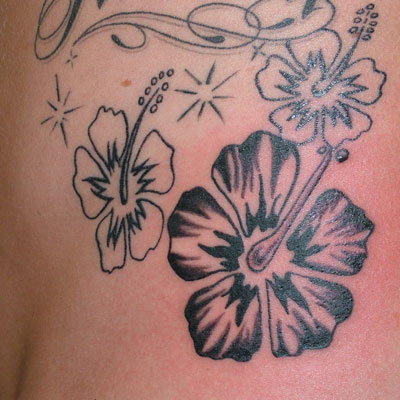 Hawaiian Flower Tattoo Design On The Side Body Women