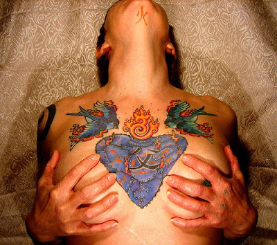 girls tattoos on chest tattoos consists of flame tattoos and twin swallow 