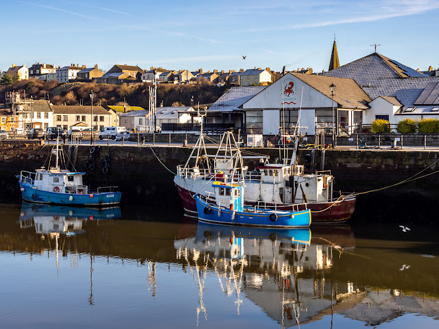 Photo of a calm day at Maryport Harbour