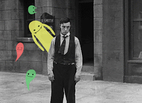Buster Keaton being surrounded by colorful ghosts.