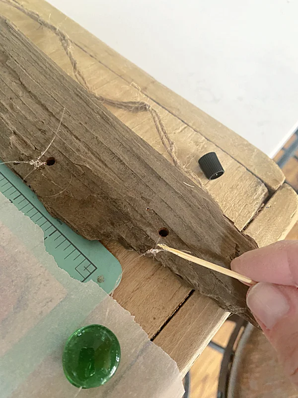 wooden board with holes and strings