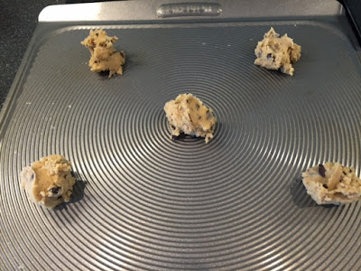 American Style Chocolate Chip Cookie dough balls on a cookie sheet