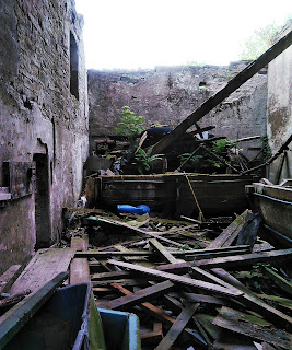 <img src="Wardle Tannery.jpeg" alt=" image of derelict mill in wardle, internal workshop" />