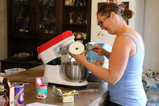 Smiling cook making lovely cake