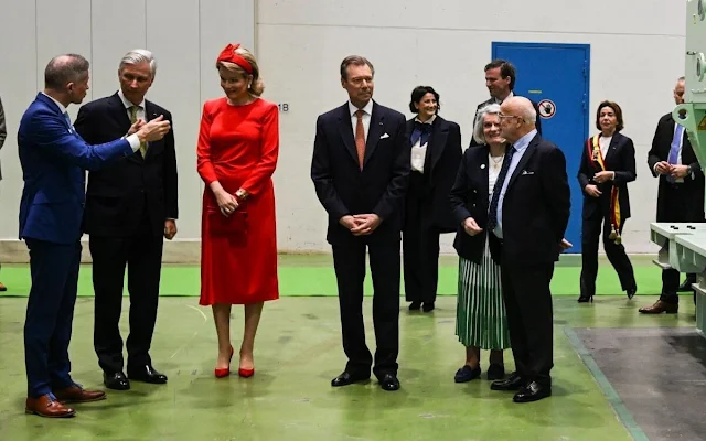 Queen Mathilde wore a red dress by Natan, Grand Duchess Maria Teresa wore a green belted jacket by Alexander McQueen