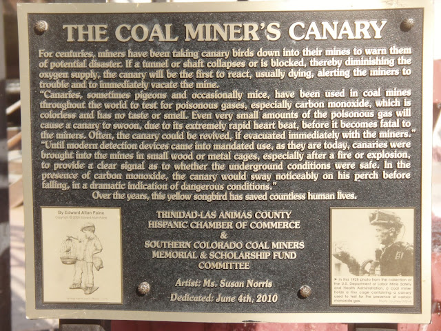 plaque explaining the use of the canary in the coal mines